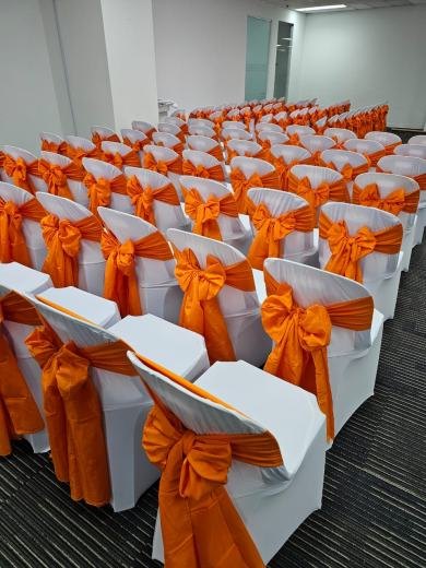 Plastic Chair White Cover with Orange Ribbon - Setup event photo 1, 2024